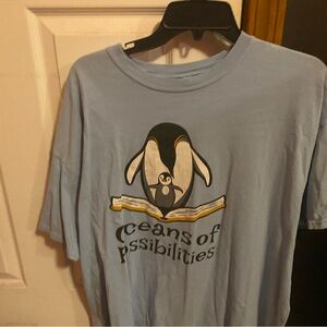 Light Blue Graphic T-Shirt with Penguin Design
